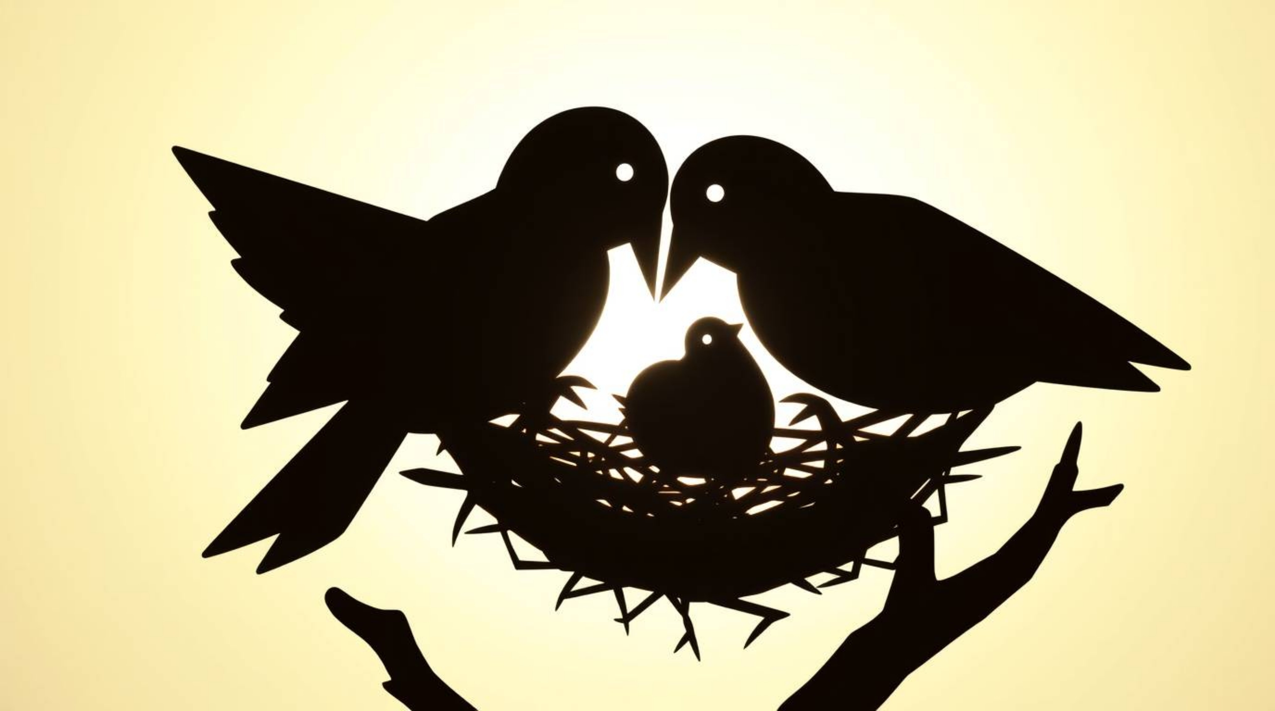 Two cartoon birds meticulously construct their nest in a charming, classic animation style, presented as a striking silhouett