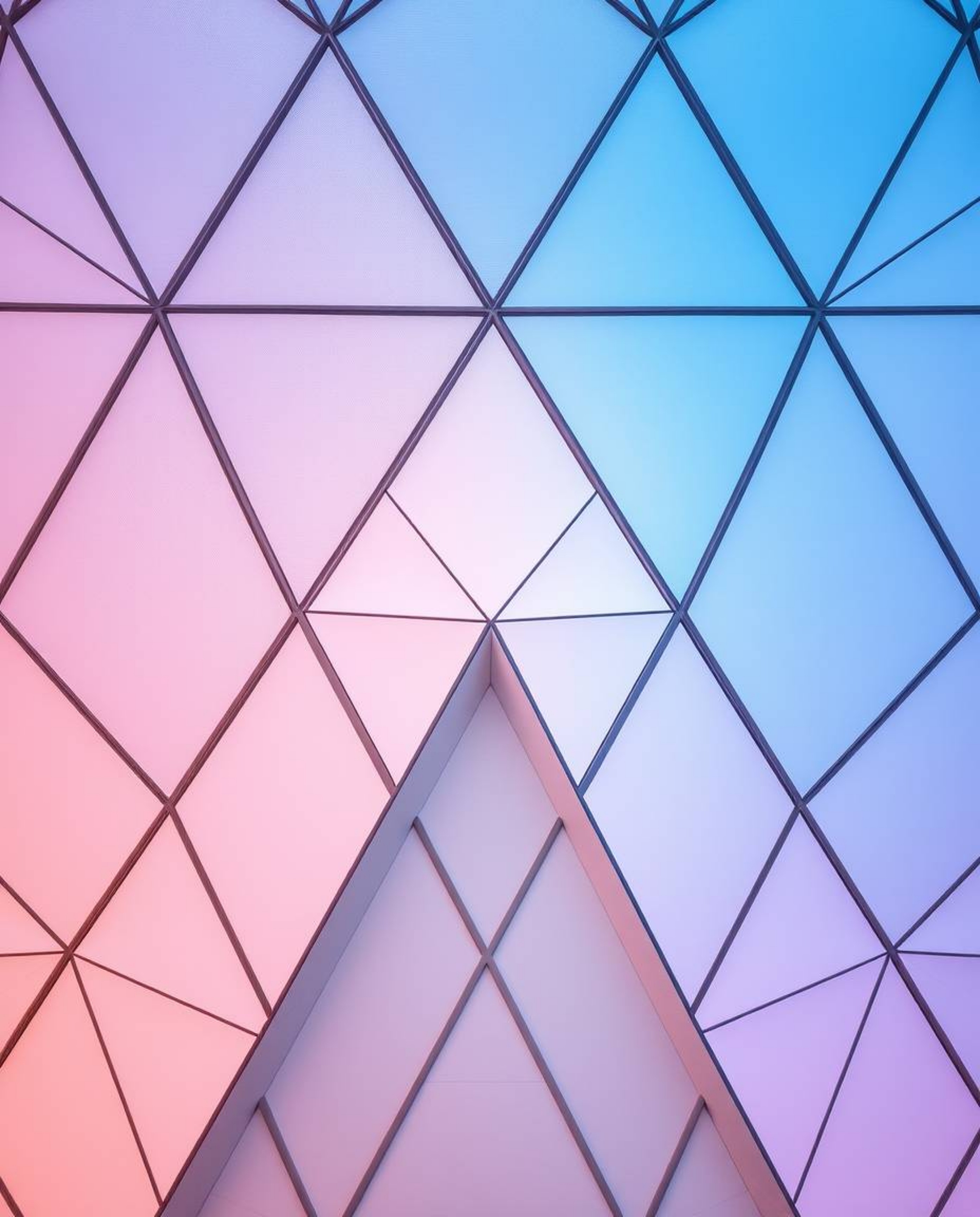 Explore a collection of geometric pattern wallpapers featuring pastel gradients and soft modern designs.  These wallpapers ca