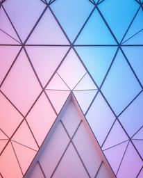 Explore a collection of geometric pattern wallpapers featuring pastel gradients and soft modern designs.  These wallpapers ca