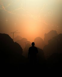 Overhead bird's eye view of a silhouetted digital glitch landscape breaking apart, illuminated with backlighting from behind,