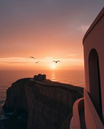 This is an architectural color photograph capturing a sunset over a coastal cliff, with soaring birds adding a dynamic elemen