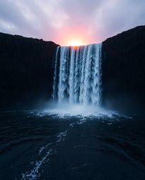 A top-down view of a wet, rainy scene with a sun setting behind a dramatic waterfall. The image captures reflective surfaces 