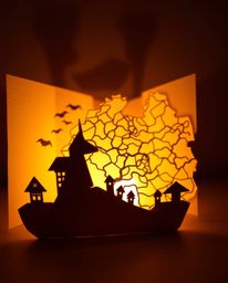 A mesmerizing artwork featuring an intricate origami-style glowing map silhouetted against dramatic backlighting in a vintage