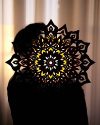 Discover stunning images of silhouetted and vibrant geometric floral mandalas.  These symmetrical designs feature soft, dream