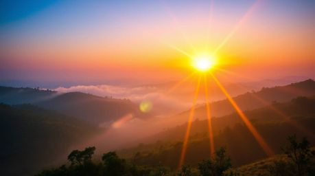 Experience the breathtaking beauty of a fog-covered hillscape at sunset, captured in stunning 8k resolution.  This image show