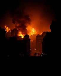 Experience a city consumed by flames, depicted through striking chiaroscuro lighting that creates strong contrasts between li