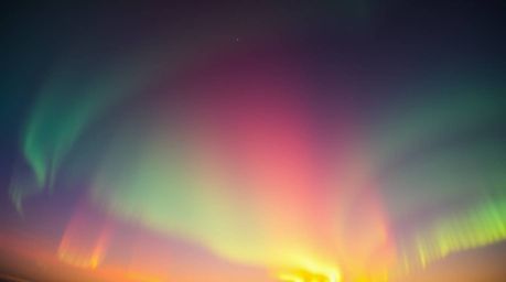 Witness the magical display of the Aurora Borealis as it emerges over a vibrant sunset sky in this tight close-up shot.  Irid