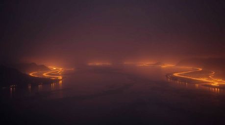 Experience the breathtaking beauty of a river delta bathed in the warm glow of twilight.  This captivating image, rendered wi