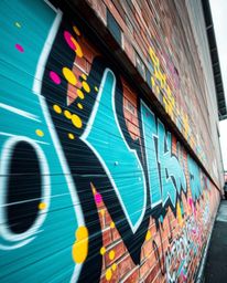 Capture the vibrant energy of street art with these precise architectural color photographs of graffiti-style splashes on a b
