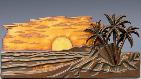 This antique bronze sculpture captures the serene beauty of a tropical beach sunset.  Featuring swaying palm trees and a pati