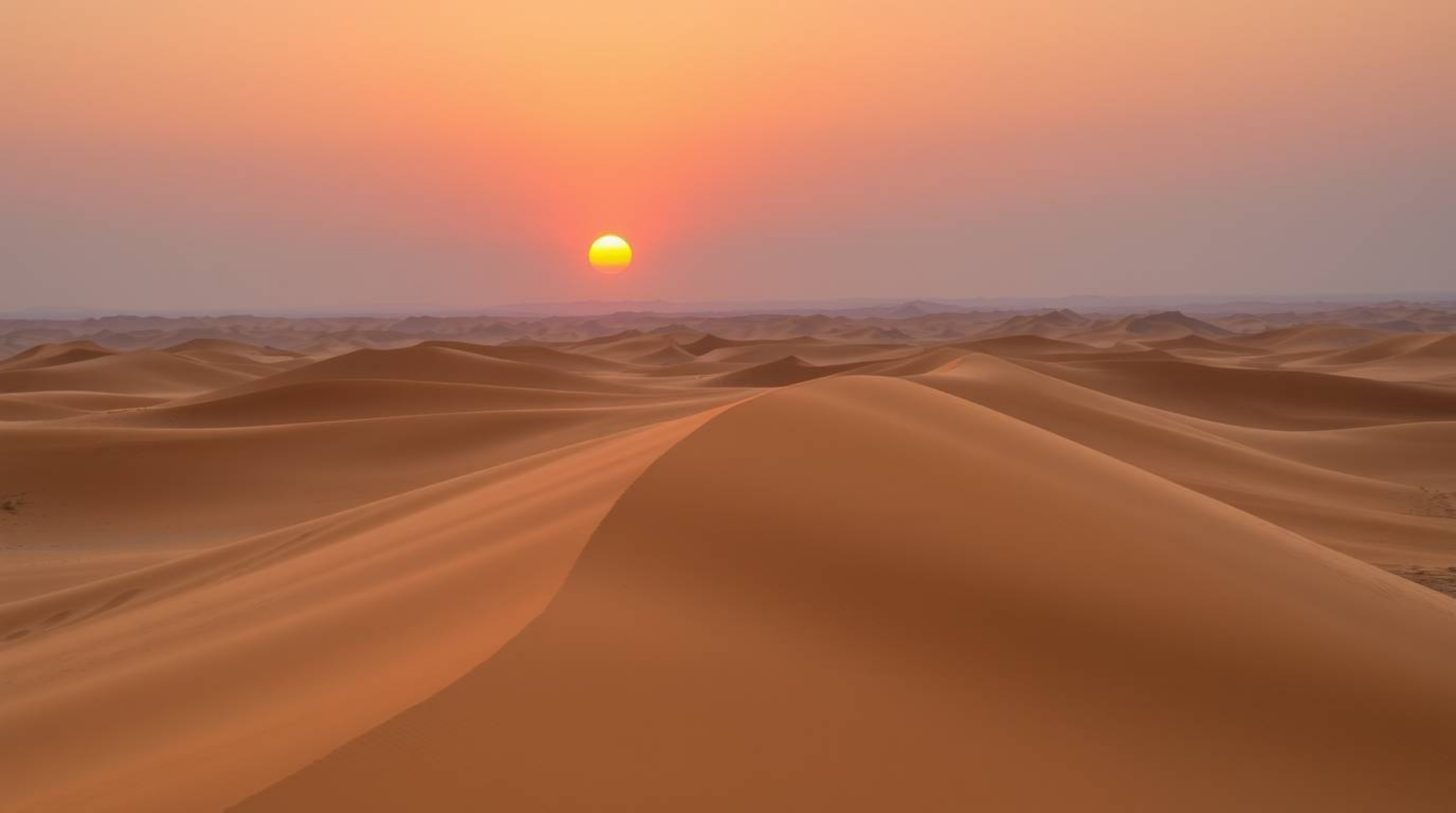 Experience the serene beauty of a desert sunset captured from a high-angle perspective. Witness the golden dunes bathed in ge