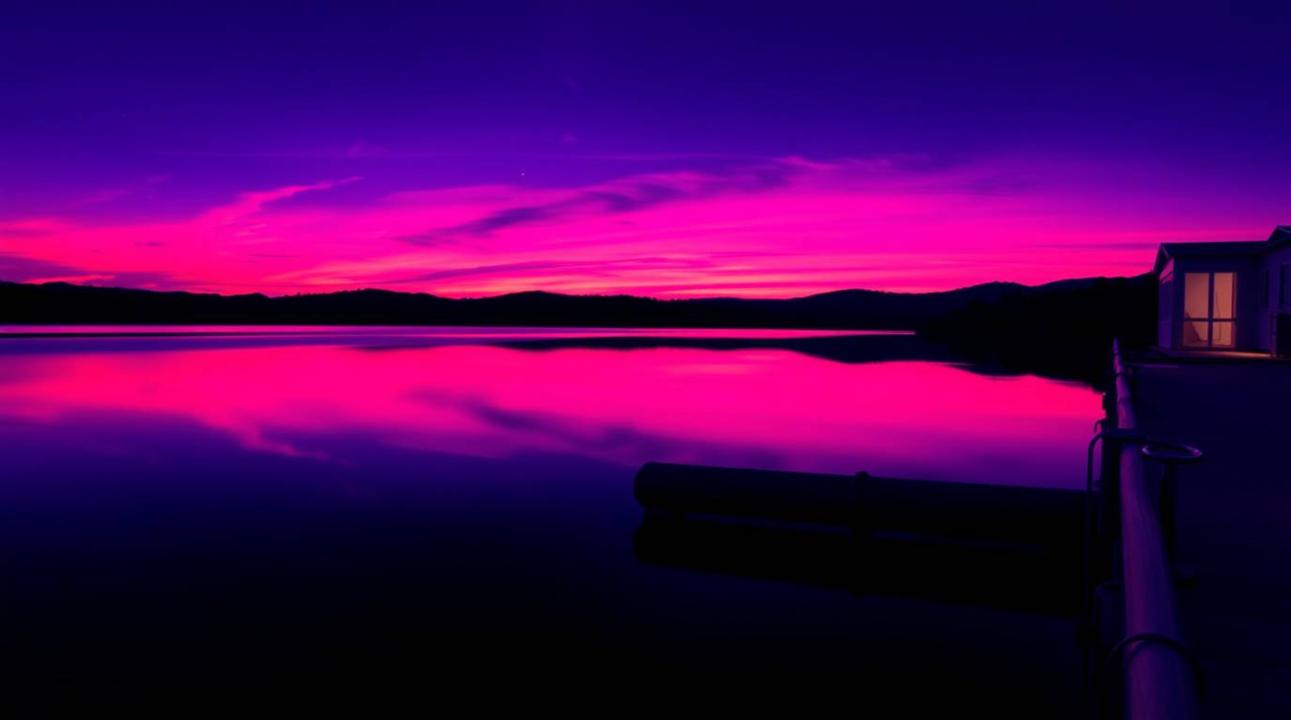 Explore stunning creative light art featuring deep ultraviolet hues and precise architectural color photography. A serene lak