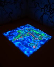A captivating close-up reveals a glowing map projection in a dimly lit, antique study.  Bioluminescent colors illuminate the 