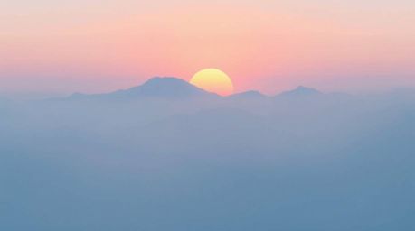A flat, two-dimensional depiction of snow-covered mountains illuminated by a pastel sunset, shrouded in a thick fog. The desi