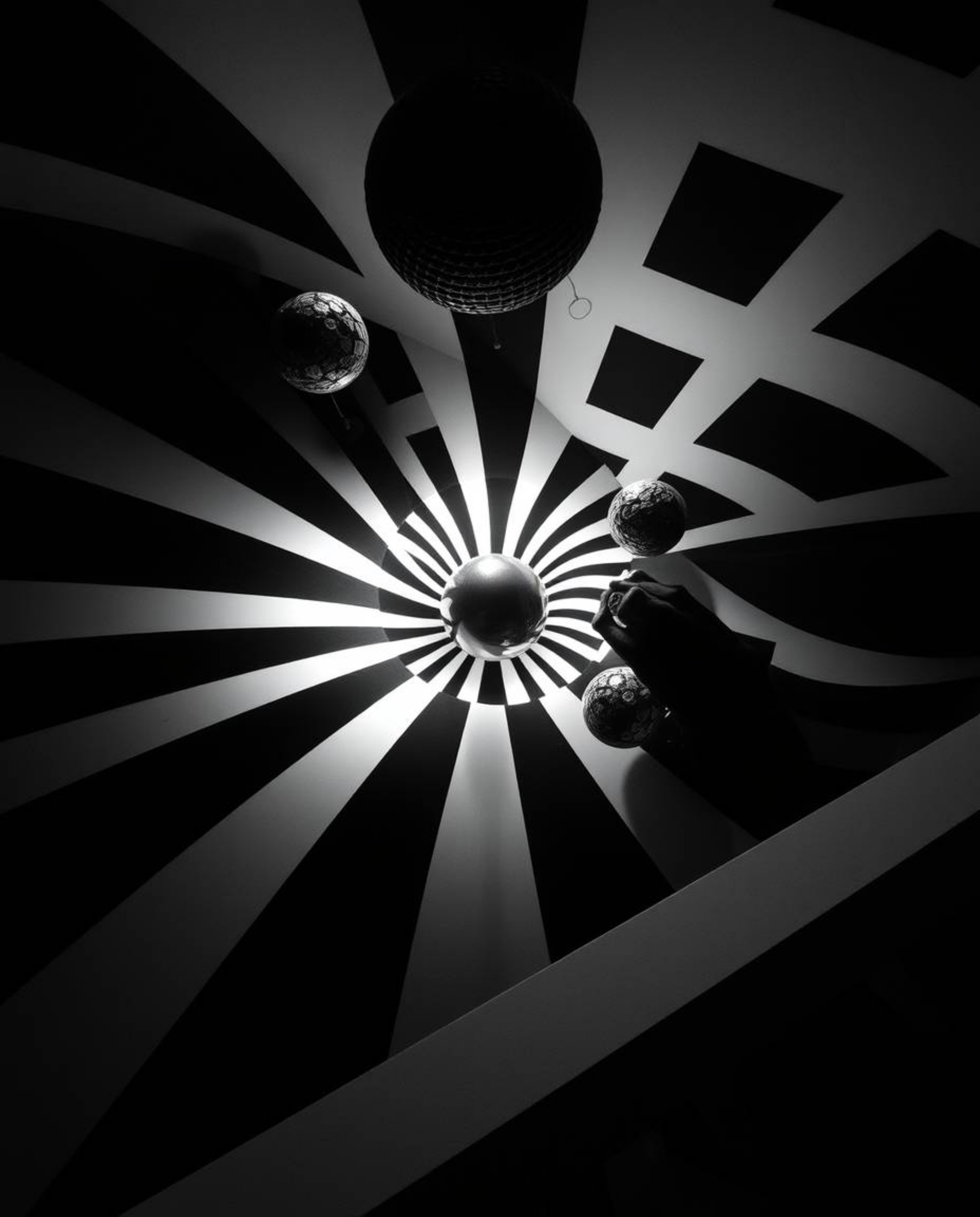 Explore a dreamlike and surreal world with this black and white geometric optical illusion image. The intense dramatic lighti