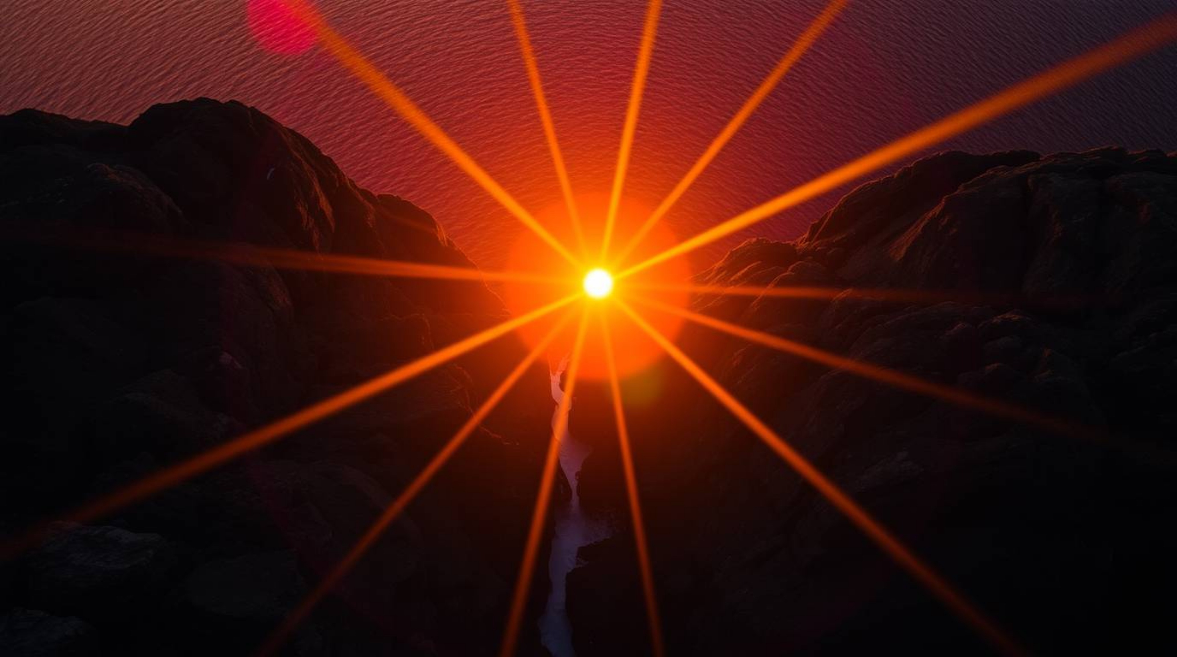 Experience the breathtaking beauty of a vibrant sunset over dramatic cliffs and crashing waves. This stunning aerial shot cap