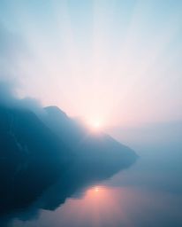 This artwork captures the reflection of a sunset in a glassy fjord, defined by its use of volumetric lighting. The scene is c