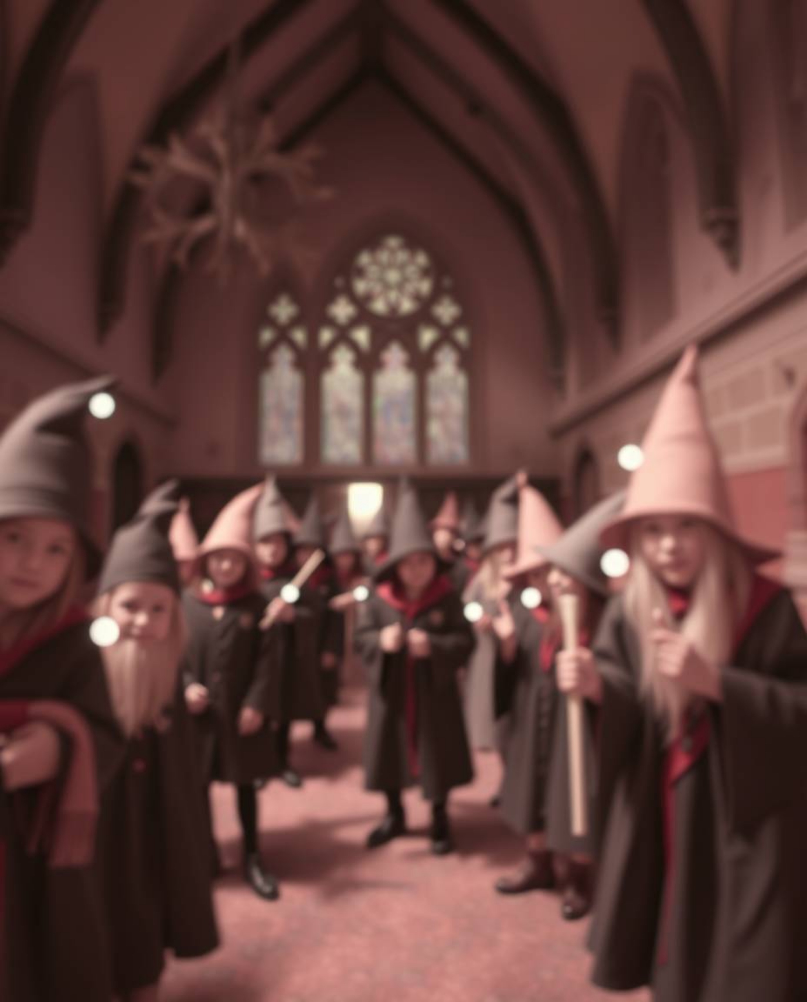 This image showcases a magical school brimming with young wizards, rendered with a captivating blurred bokeh effect and surre
