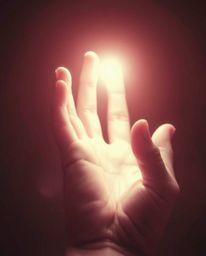 This artwork showcases a surreal infrared image of a hand reaching towards the light, emerging from darkness. The refined fea