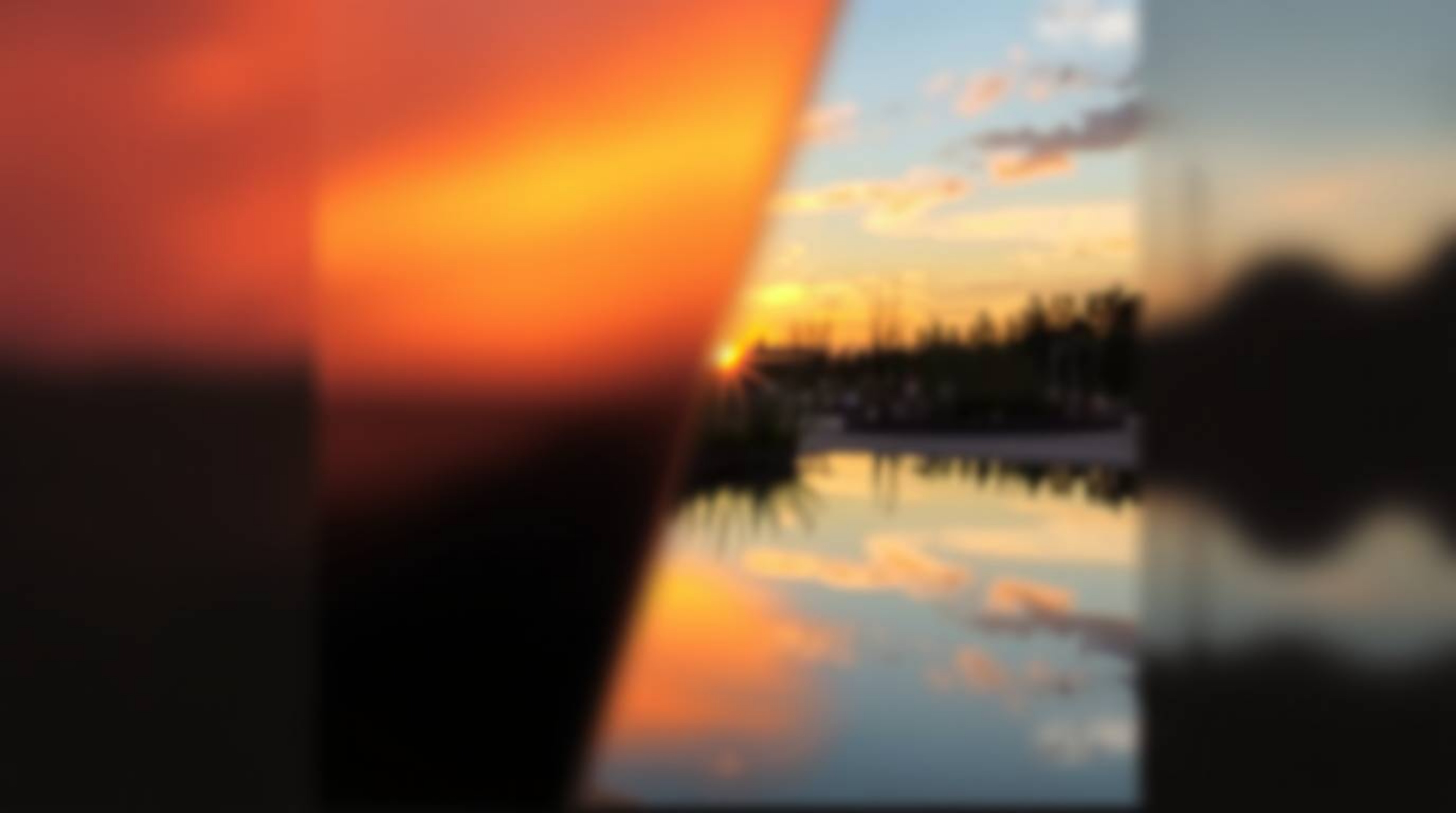 A captivating image showcasing a distinct split focus effect. The sharp focus highlights the vibrant reflection of a colorful