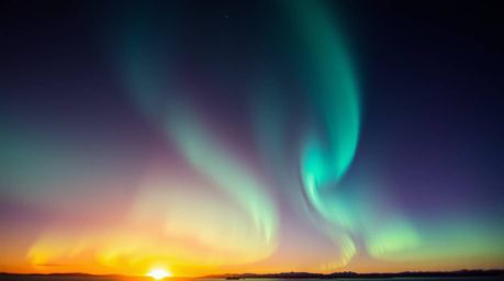 An extreme macro close-up reveals the breathtaking detail of the Northern Lights emerging over a vibrant sunset sky.  This ar