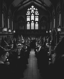 Explore a magical school brimming with young wizards, captured in a classic black and white aesthetic with a dramatic cinemat