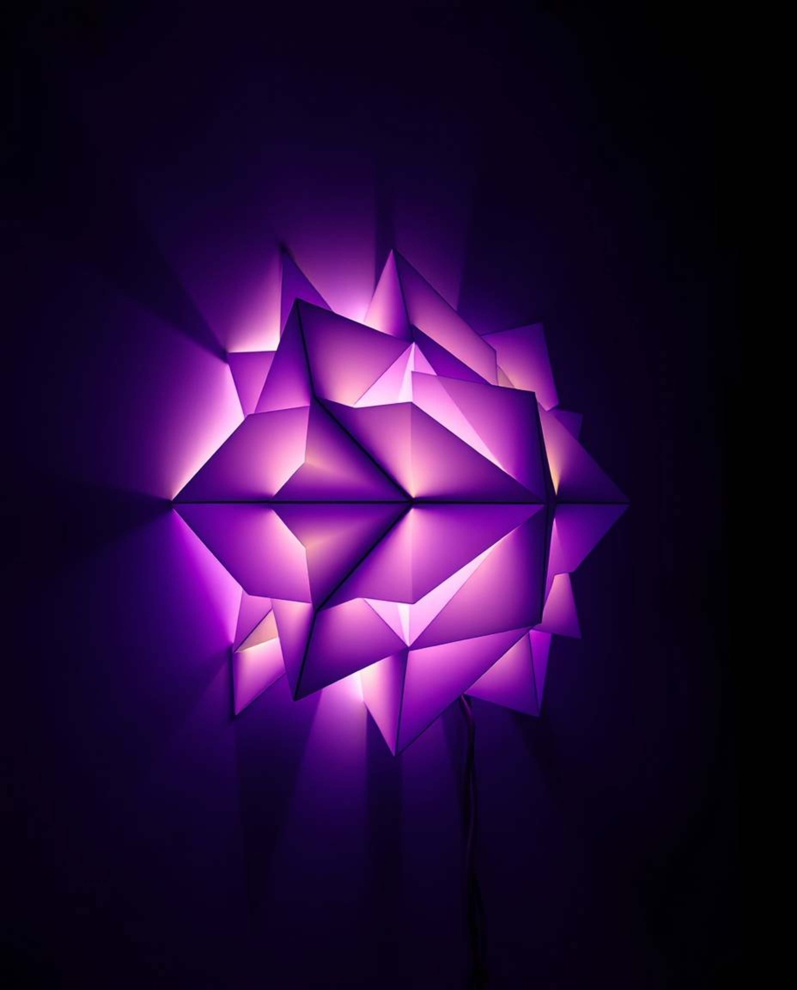 A captivating 3D light art piece showcases a geometric pattern reminiscent of folded paper.  Deep ultraviolet hues create str