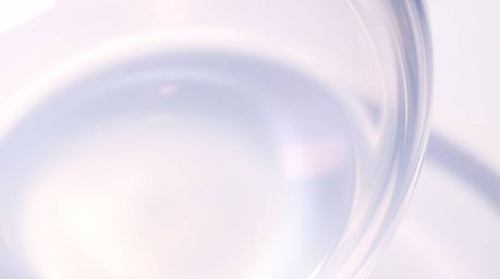 This image showcases a high-angle, soft pastel Isekai anime style close-up of a glass object.  It beautifully reflects smooth