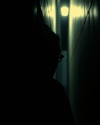 Experience a dramatic cinematic scene with eyes watching from the shadows of a night alley. This image features a film-like c