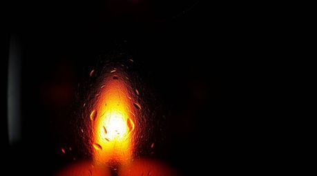 A captivating close-up captures the intricate details of a glass object reflecting smooth gradient textures. Illuminated by i