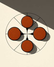 An overhead shot reveals a minimalist geometric pattern in the Bauhaus style. Composed of intersecting circles and lines, the