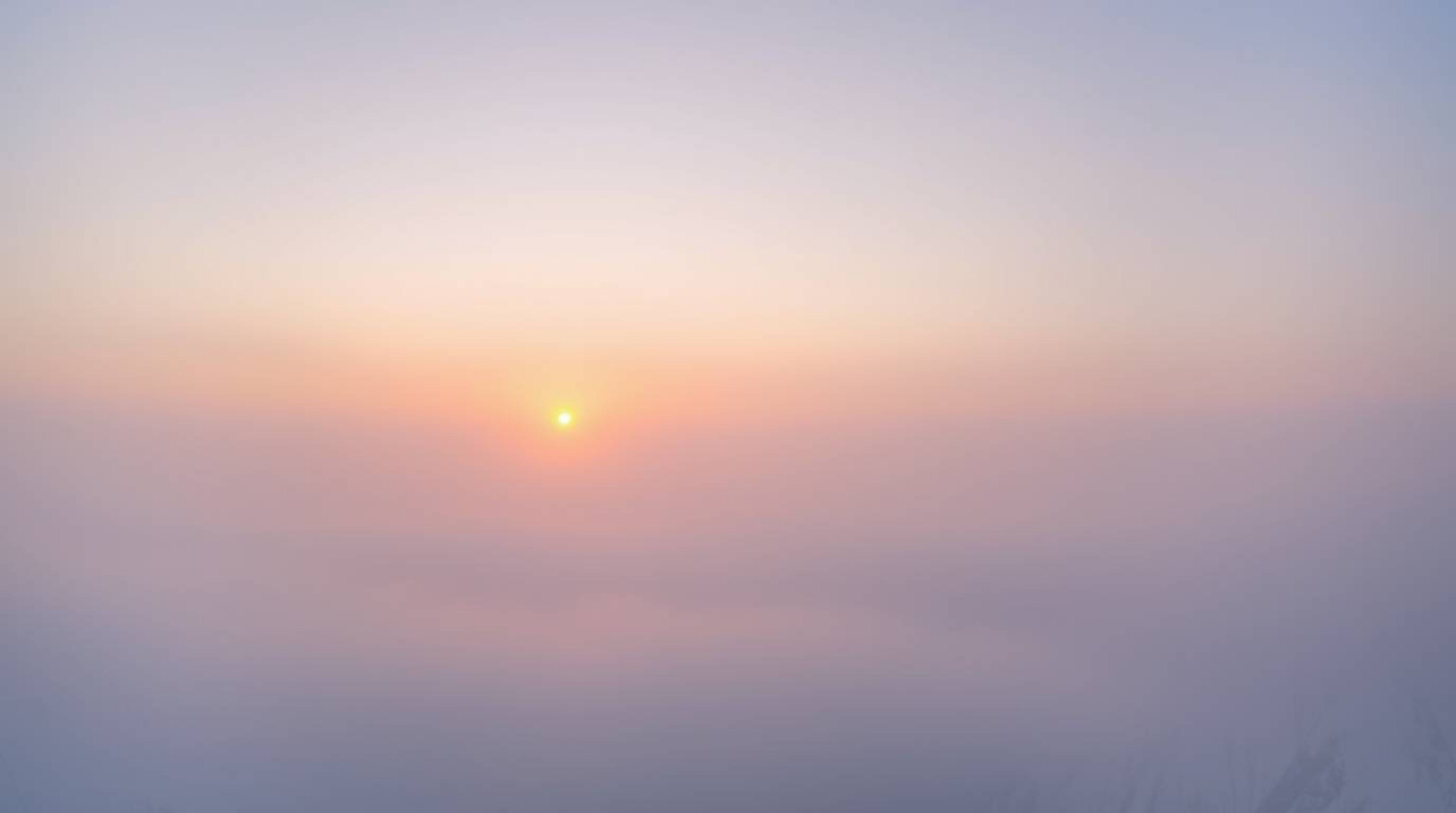 Experience the serene beauty of a sunset over icy glaciers in a polar region.  This breathtaking scene features soft pastel c
