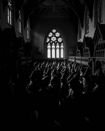 Explore a classic black and white image of a magical school brimming with young wizards, masterfully utilizing contrasting ch