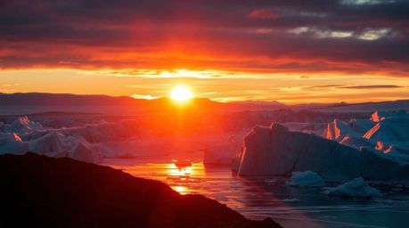 Experience the breathtaking beauty of a polar sunset dramatically illuminated by chiaroscuro lighting.  This stunning 16:9 im