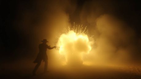 Capture the gentle soft light and ethereal spiritual vibe of a classic exploding TNT gag set in the wild west. This scene fea