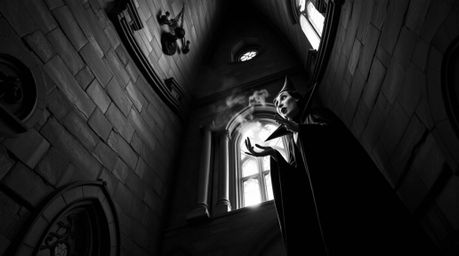 This captivating low angle black and white photograph showcases a classic Disney villain immersed in casting a spell within t