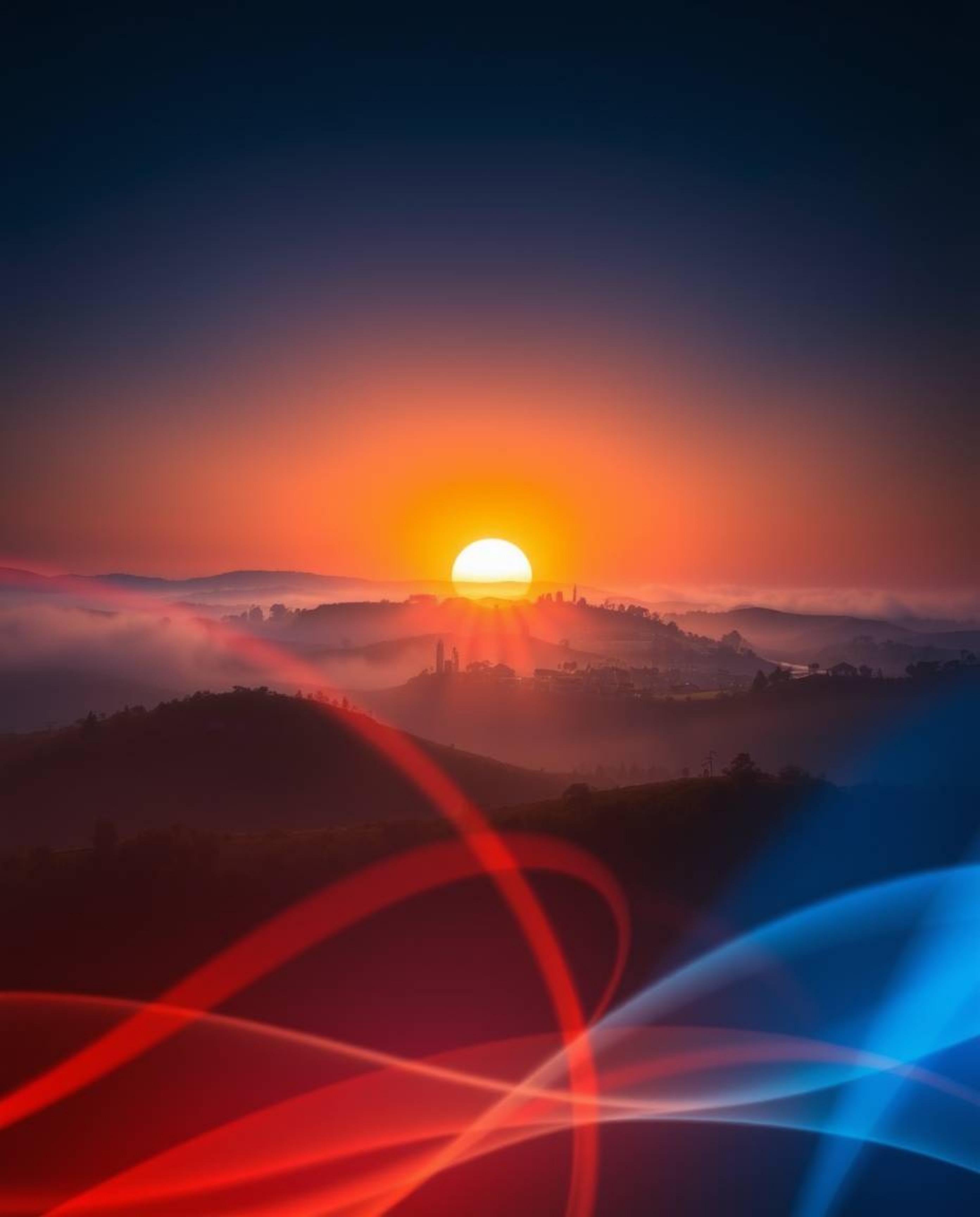 This is a creative light art piece depicting a sunset over the misty, rolling hills of Tuscany. The artwork is defined by its
