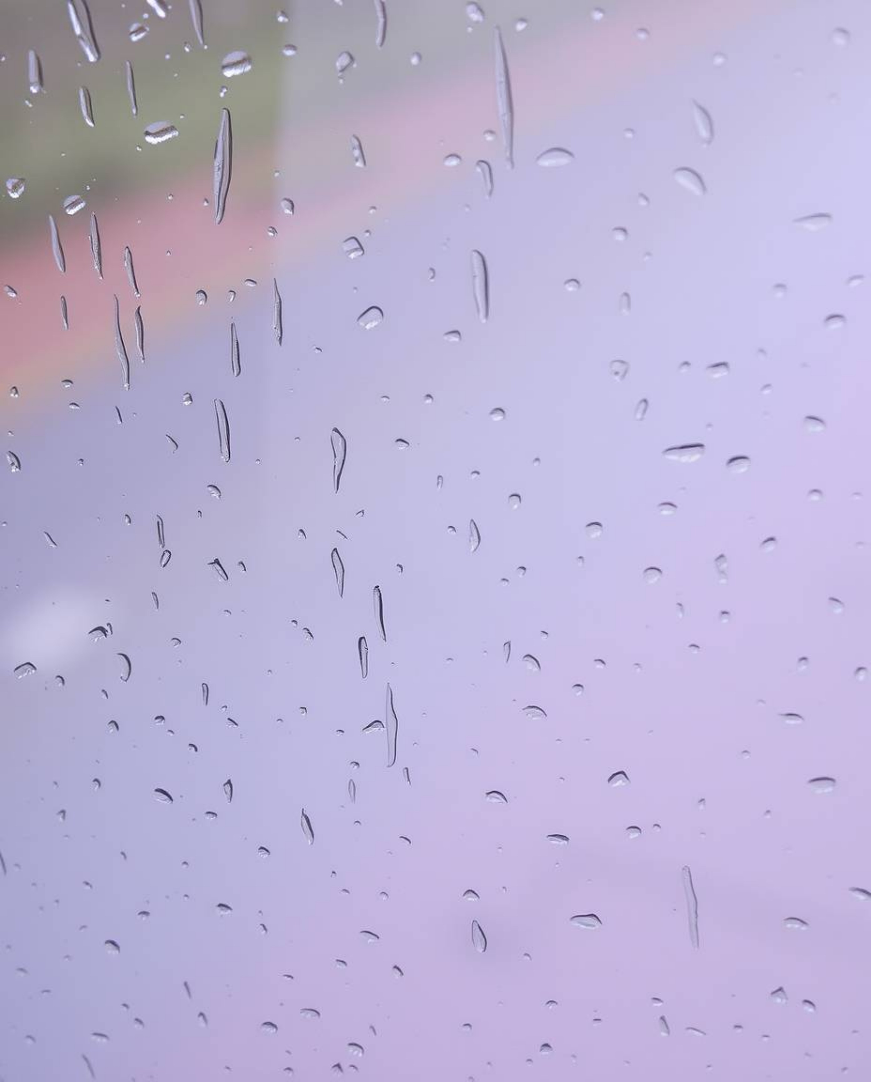 A captivating image featuring a wet rainy scene with natural earth tones.  The soft gradient texture blends pink, blue, and v