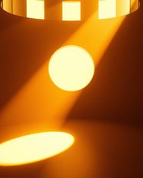 Experience the captivating blend of modern minimalism and cinematic artistry with this image. Bathed in the warm glow of gold