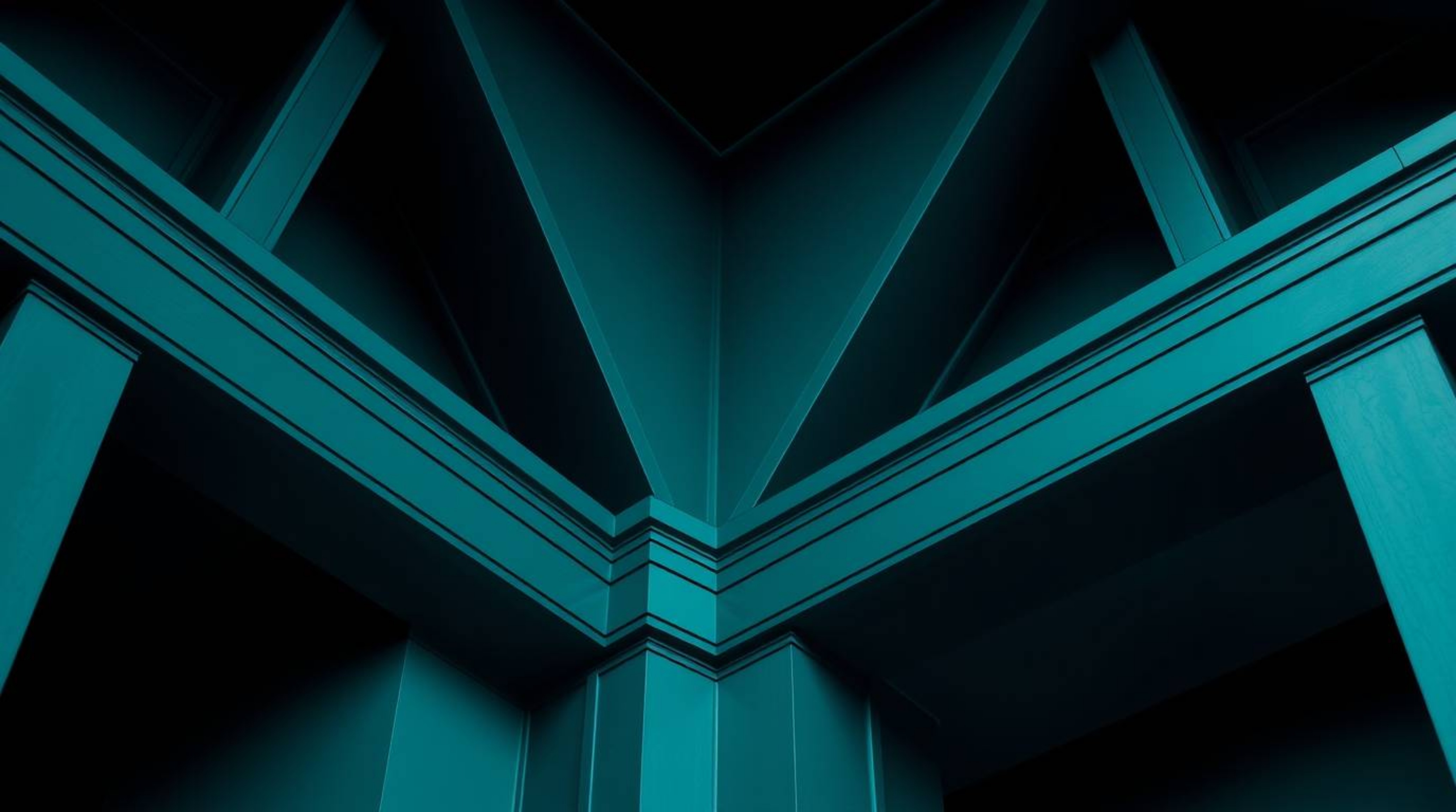 Explore the intersection of rich teal tones and precise architectural photography, capturing sharp lines and detailed structu