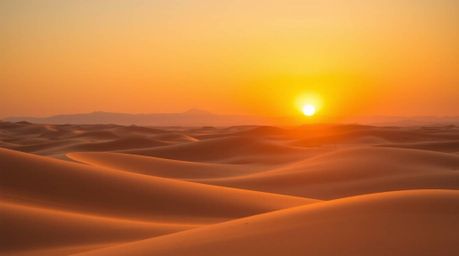 A captivating fine art photograph showcasing a breathtaking sunset over golden desert dunes.  The image is composed of distin