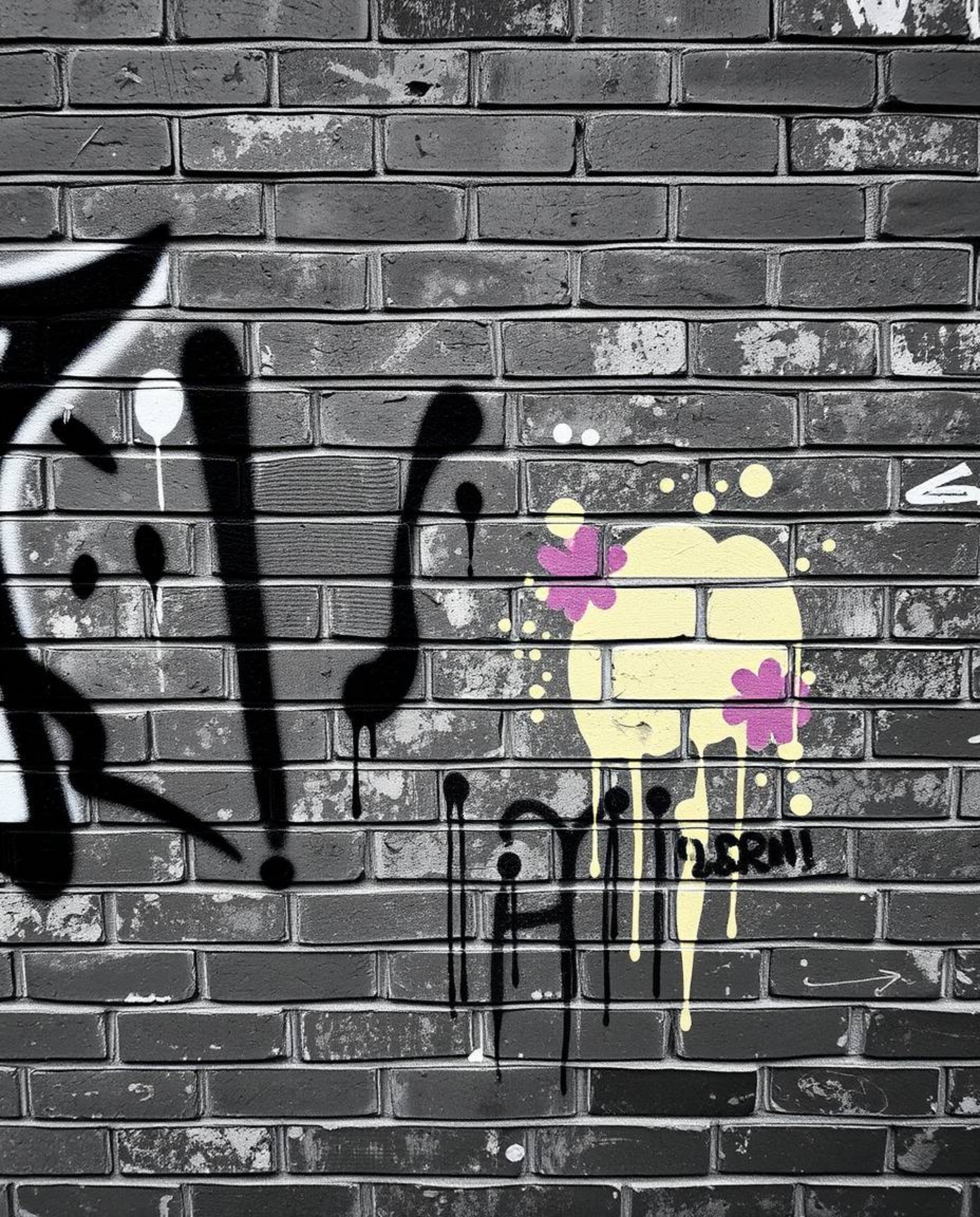 This photograph captures a compelling contrast between a timeless black and white aesthetic and vibrant, graffiti-style splas
