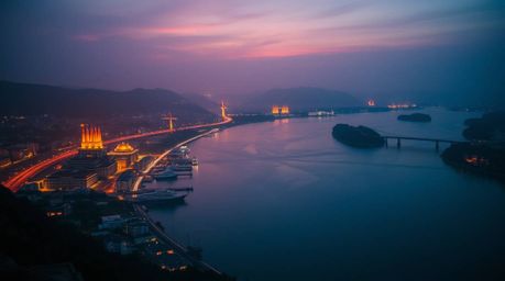 A dramatic cinematic photograph capturing the beauty of a river delta glowing in twilight hues. This image features sharp lin