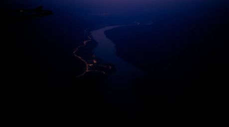 A captivating image of a river delta silhouetted against a twilight sky.  Strong backlighting enhances the dramatic shapes an
