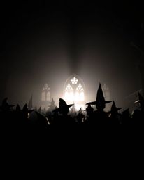This image showcases a magical school brimming with young wizards, presented as a captivating silhouette with a light source 