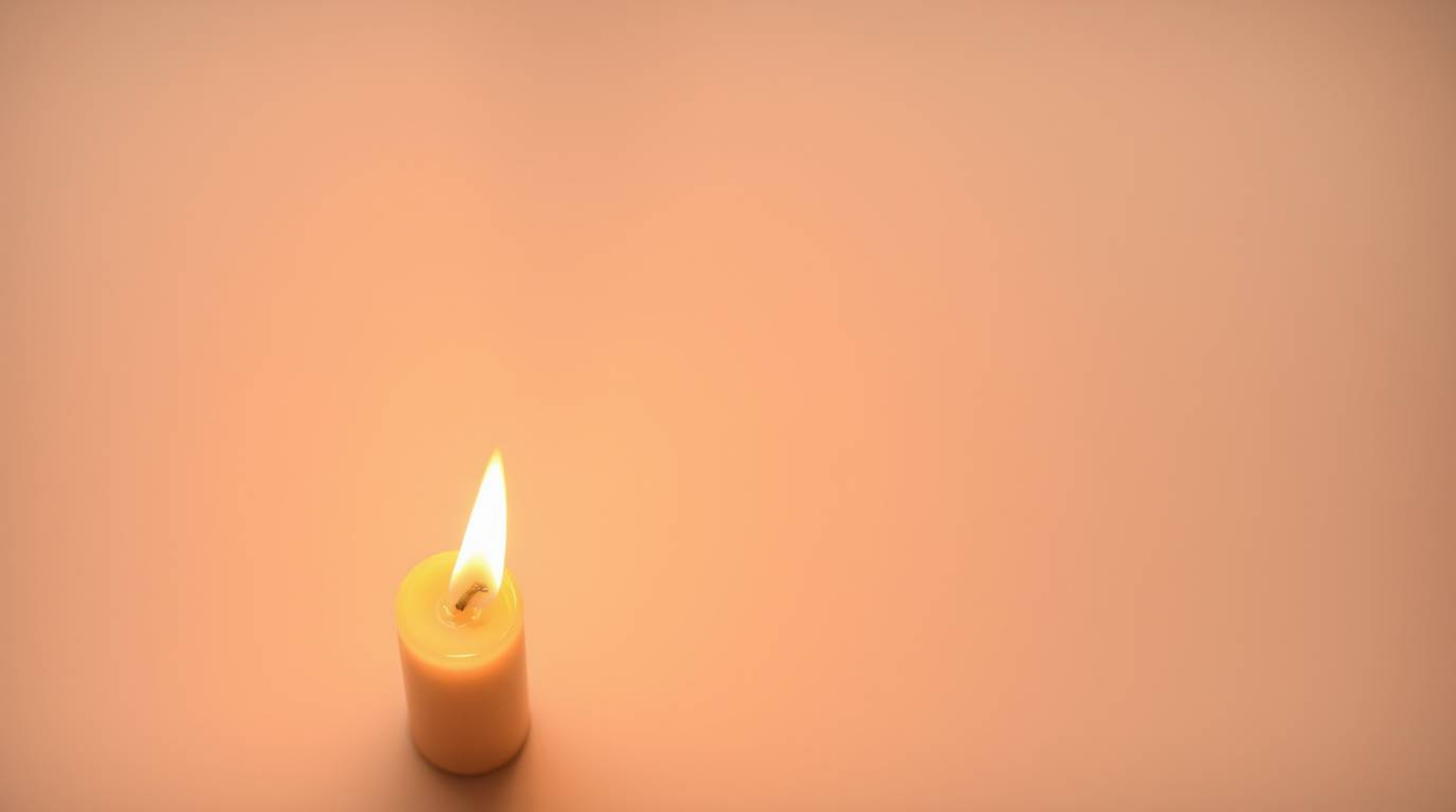 Experience the serene beauty of warm candlelight set against an abstract gradient background with a delicate paper grain text