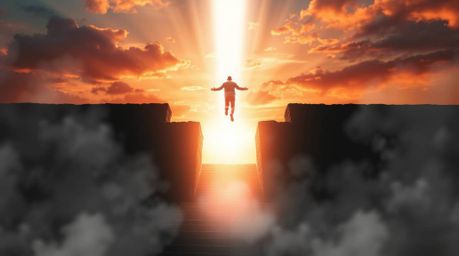 A captivating image showcases a lone figure ascending a stone staircase towards a radiant beam of divine light. The scene is 