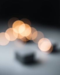 Explore the captivating world of moody style, where blurred bokeh effects meet sharply focused 3D shapes. This futuristic art