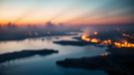 A stunning photorealistic image of a river delta bathed in the warm glow of twilight.  Volumetric lighting creates a magical 