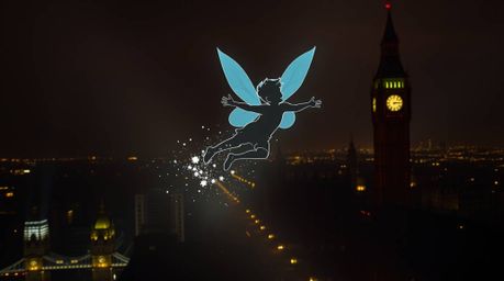 This artwork features a geometric logo inspired by intense dramatic lighting, depicting a young boy soaring above London with